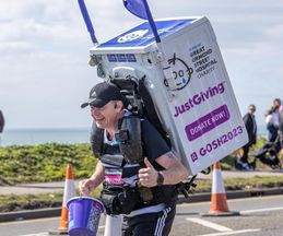 Runner carrying a washing machine